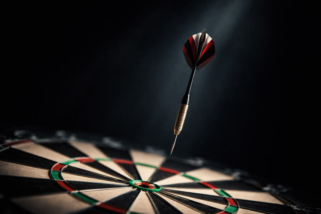 Dart frozen midair near the bullseye — value before ask