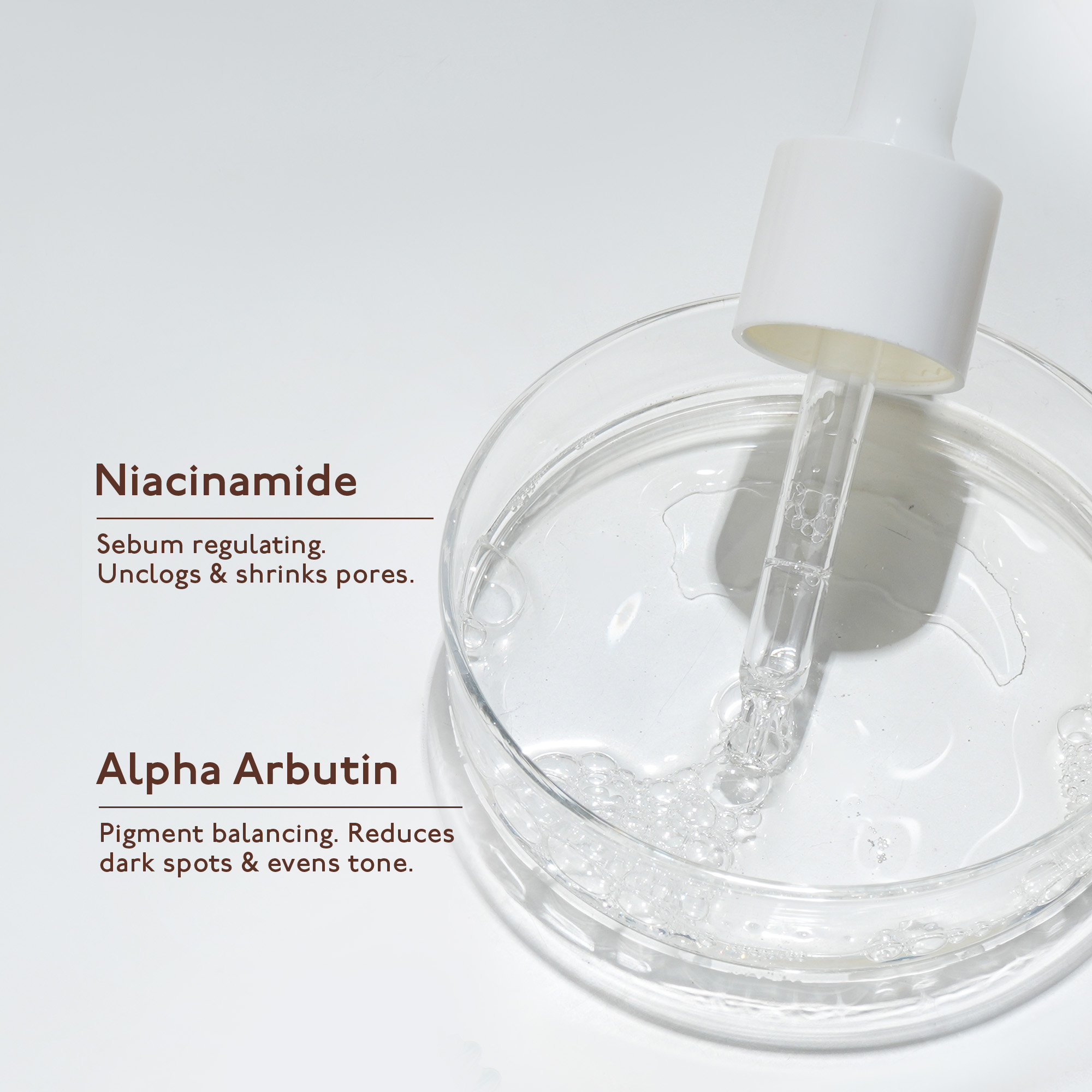 Serum bottle closeup — white background